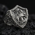 Load image into Gallery viewer, Oxidized 925 sterling silver Saint George defeating dragon ring on volcanic rock, medieval knight shield signet design
