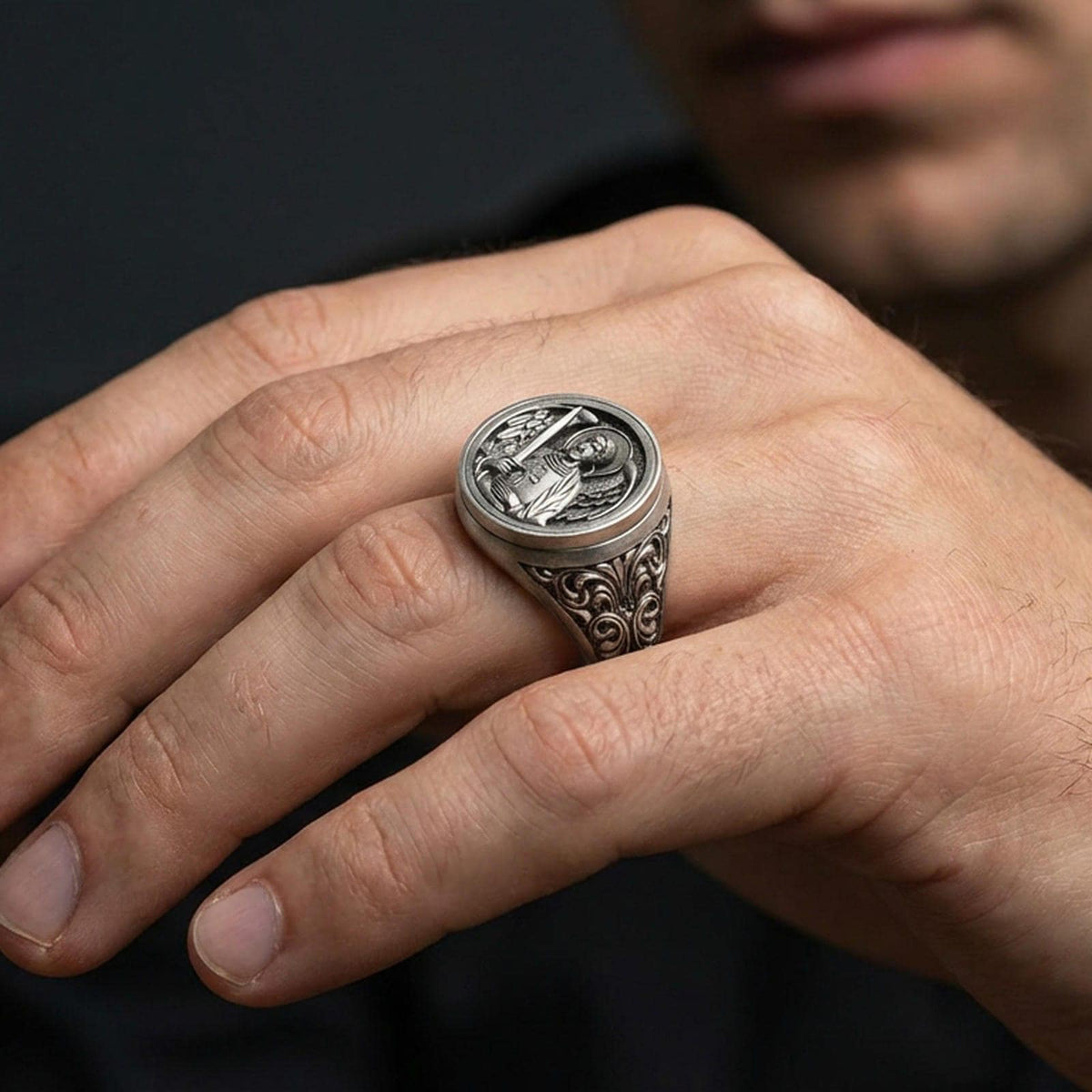 Oxidized 925 sterling silver St Michael archangel ring worn on finger, angel warrior signet with sword and cross