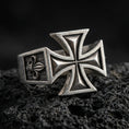 Load image into Gallery viewer, Oxidized 925 sterling silver iron cross signet ring on volcanic rock, bold raised cross relief, rugged vintage finish
