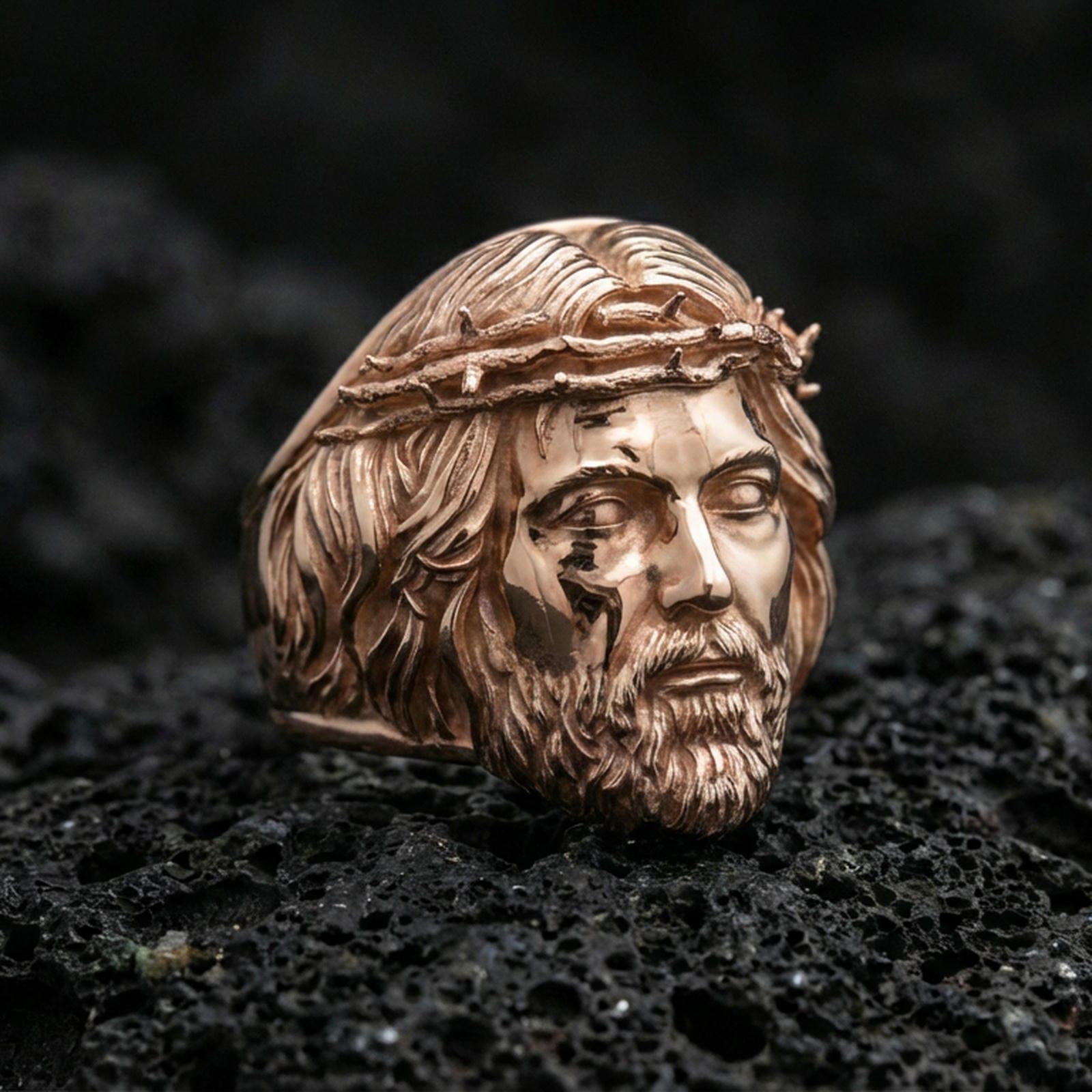 Rose gold plated Jesus crown of thorns ring on volcanic stone, sculpted Christ face, faith-inspired statement ring