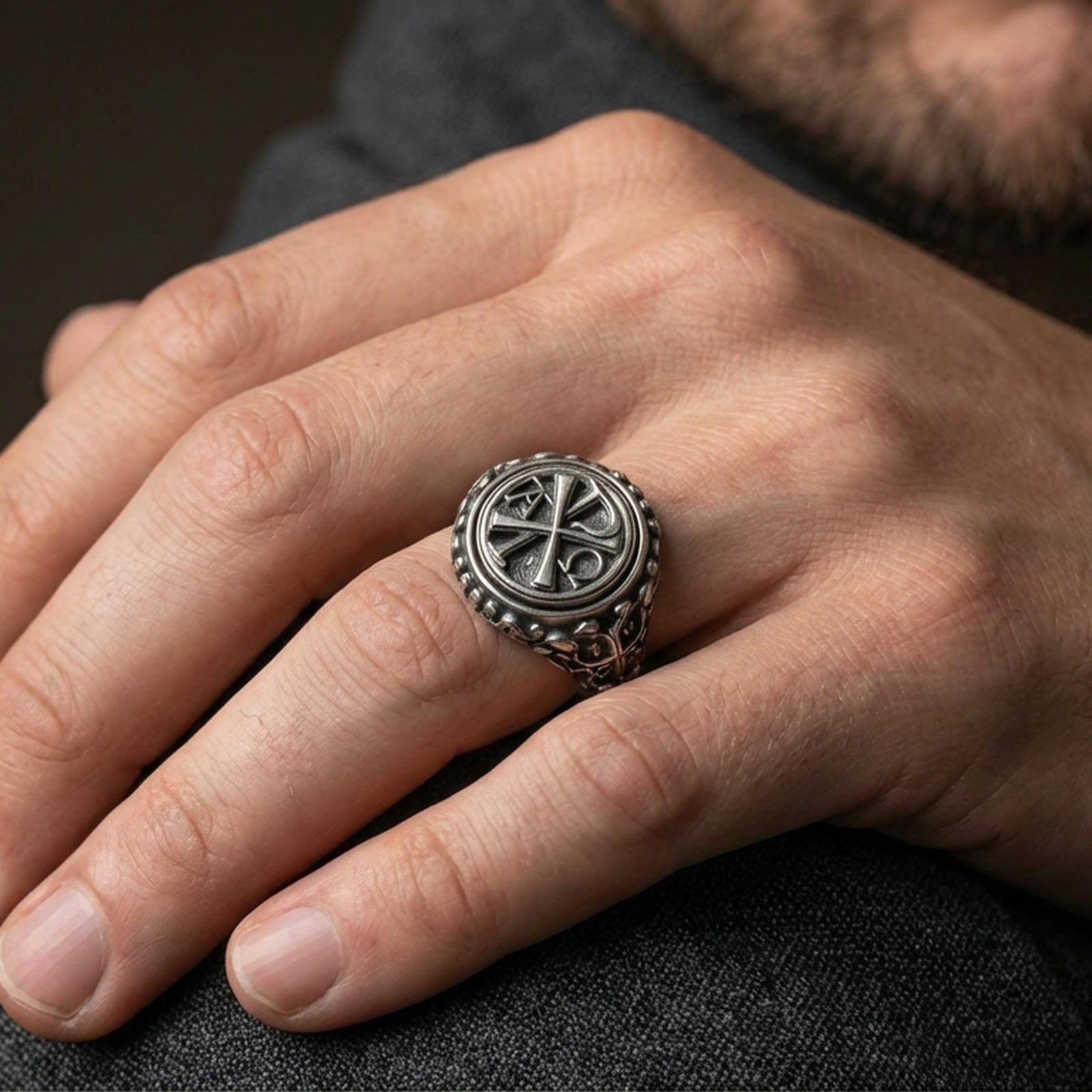 Oxidized 925 sterling silver Chi Rho ring worn on finger, Alpha Omega Christian symbol, bold signet style