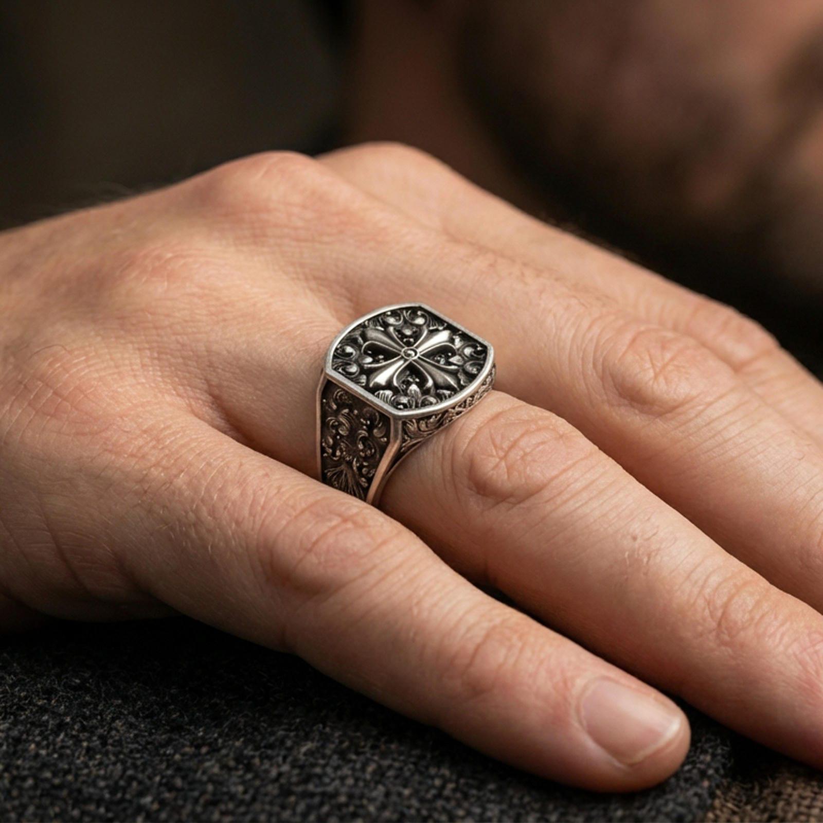 Oxidized 925 sterling silver baroque cross ring worn on finger, octagon signet style, ornate scrollwork pattern