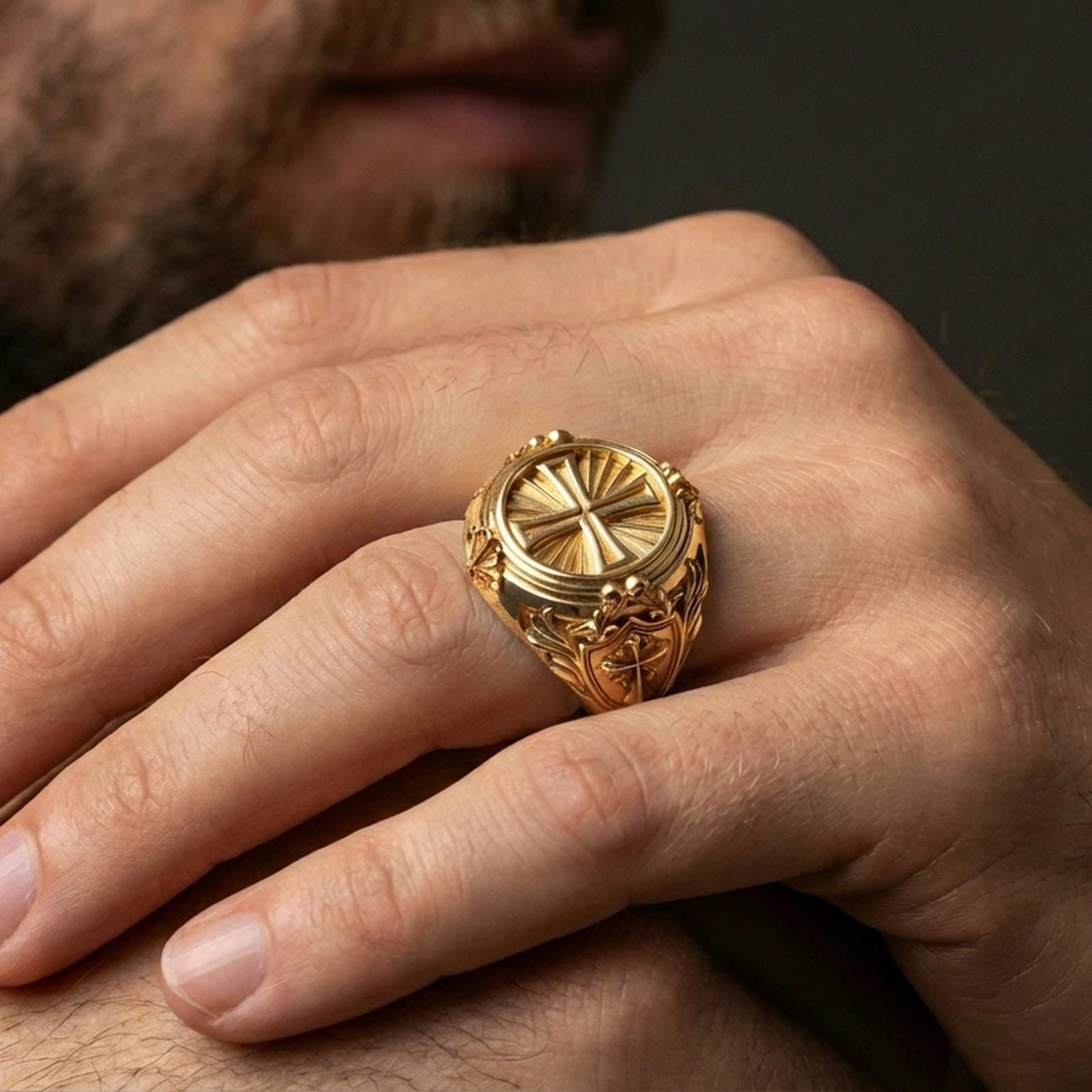 Gold plated round cross signet ring worn on finger, sunburst rays detail, elegant Christian symbol jewelry