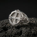 Load image into Gallery viewer, Polished silver round cross signet ring on porous volcanic stone, radiating sunburst detail, engraved ornamental shoulders
