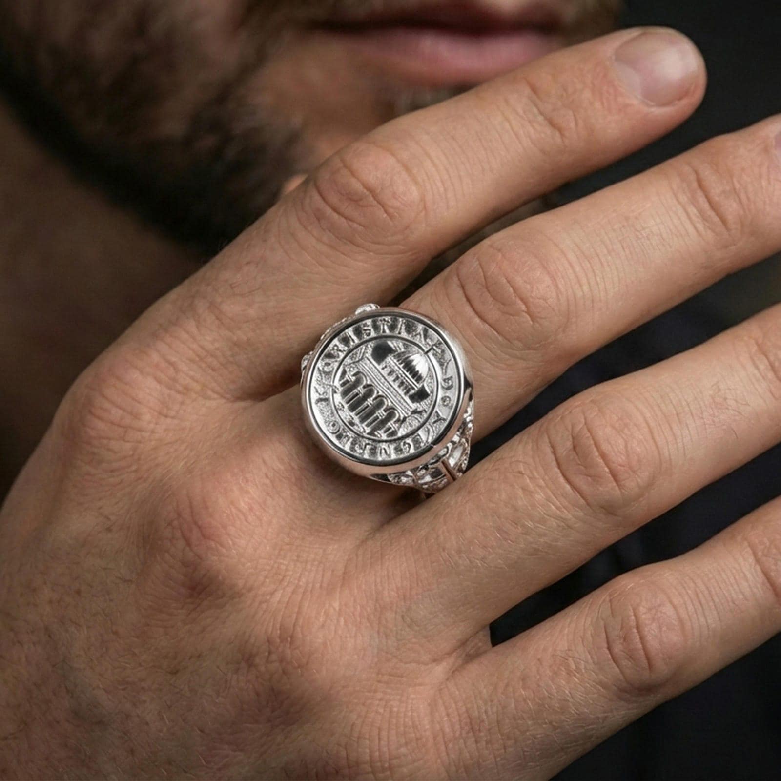 Polished silver Knights Templar seal ring worn on finger, cathedral dome emblem, detailed medieval cross shoulders