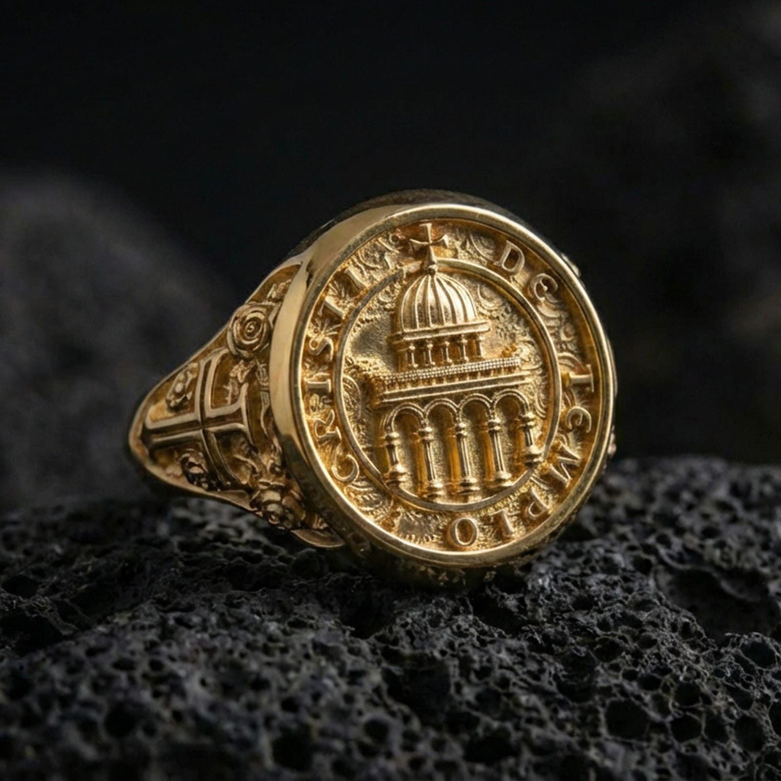 Gold plated Knights Templar signet ring on dark volcanic rock, Cristi de Templo seal with cathedral motif, ornate side cross