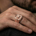 Load image into Gallery viewer, Rose gold plated Agnus Dei seal ring worn on finger, Lamb of God emblem, engraved cross shoulders and Latin inscription
