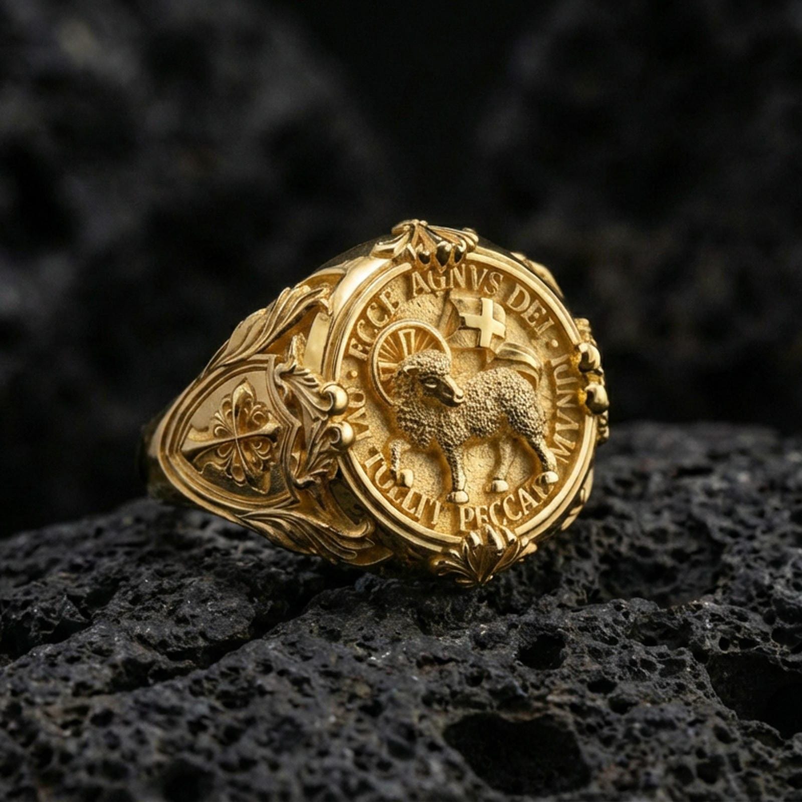 Gold plated Agnus Dei signet ring on dark volcanic rock, Lamb of God seal with Latin inscription, engraved cross shoulders