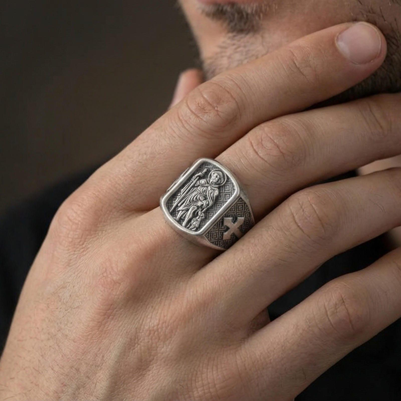 Oxidized 925 sterling silver Saint Roch signet ring worn on finger, patron saint relief with dog, cross side engraving