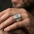 Load image into Gallery viewer, Polished silver Saint Anthony signet ring worn on finger, detailed saint engraving and cross sides, Christian devotional jewelry
