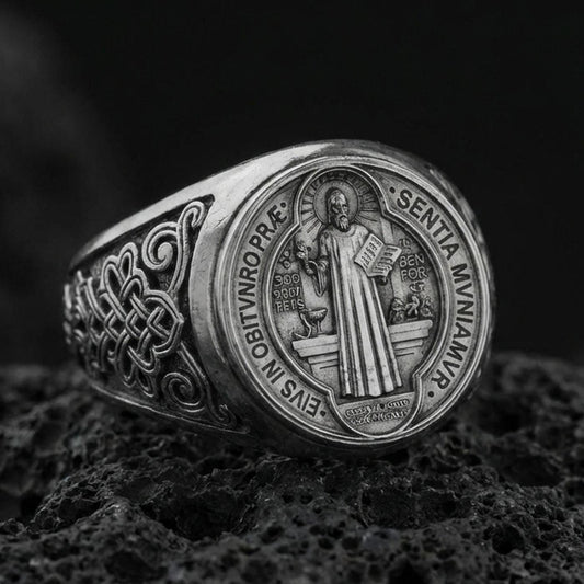 Oxidized 925 sterling silver St Benedict medal signet ring on volcanic rock, Latin prayer seal detail, Catholic protection ring
