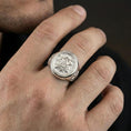 Load image into Gallery viewer, Polished silver Christian monogram signet ring worn on finger, circular monogram face with cross detail, minimalist faith ring
