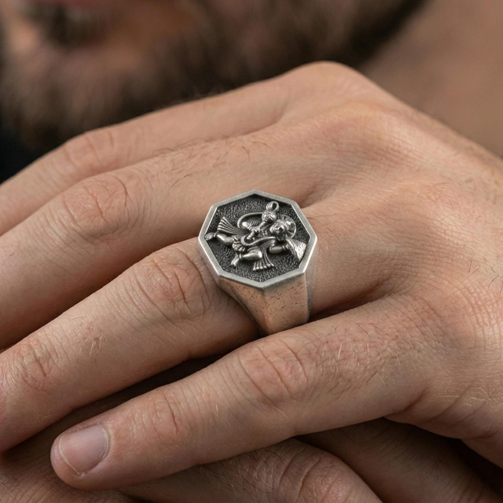 Oxidized 925 sterling silver Hanuman signet ring worn on finger, octagon face with detailed Hindu deity relief and spiritual symbolism
