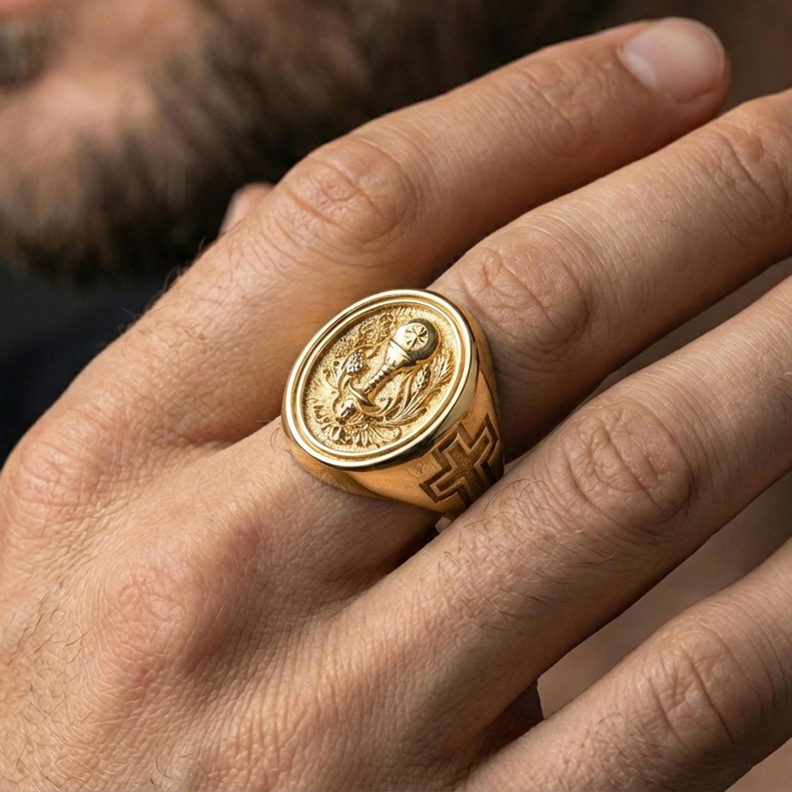Gold plated Holy Eucharist signet ring worn on finger, chalice and host symbol ring with wheat and vine details, statement style