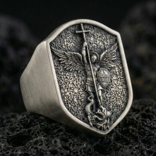 Oxidized 925 sterling silver Saint Michael ring on volcanic rock, shield signet with Archangel defeating serpent relief