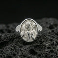 Load image into Gallery viewer, Polished silver Good Shepherd ring on porous volcanic stone, Jesus portrait with lamb over shoulders signet design
