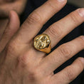 Load image into Gallery viewer, Gold plated Jesus the Good Shepherd ring worn on finger, shepherd relief medallion face in classic signet style
