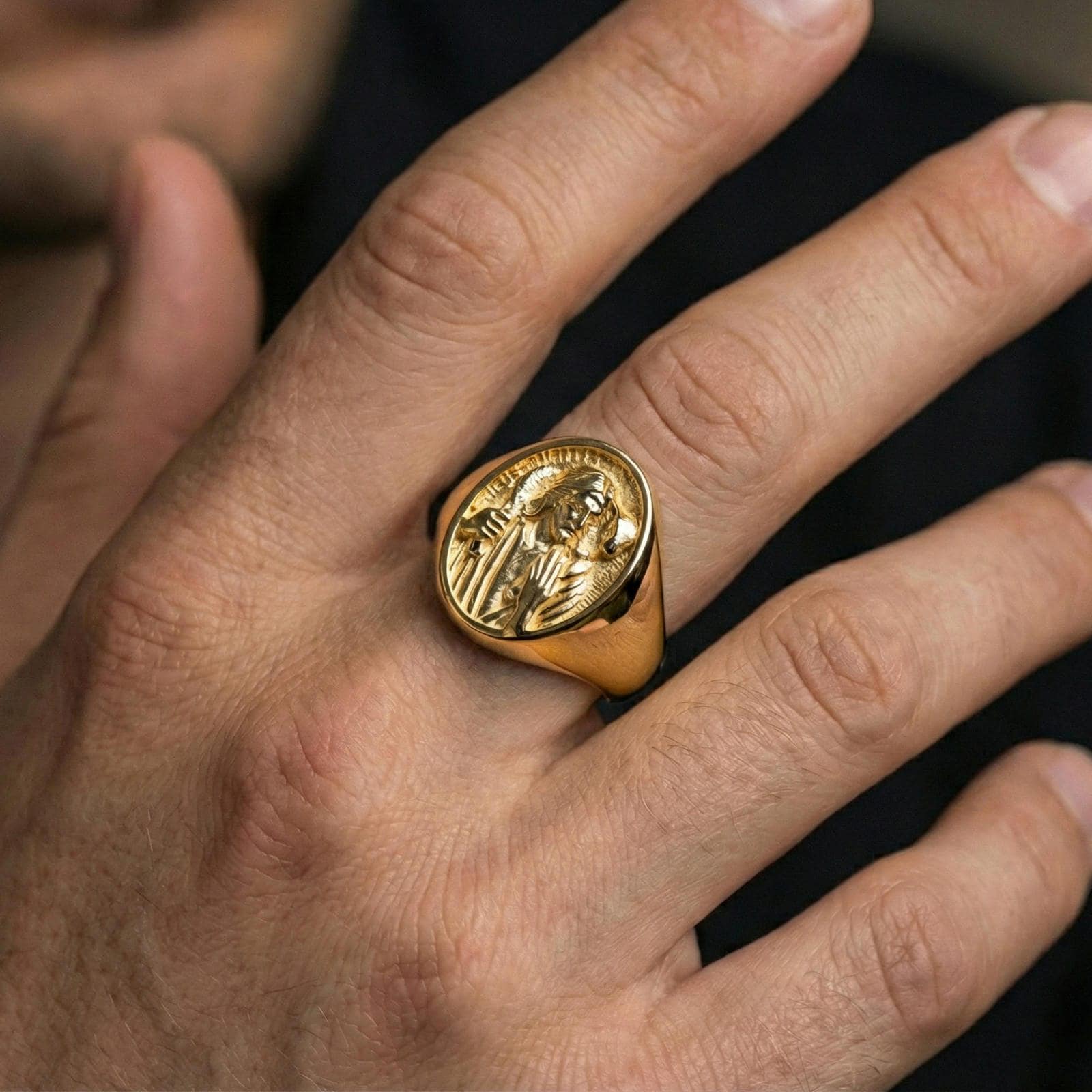 Gold plated Jesus the Good Shepherd ring worn on finger, shepherd relief medallion face in classic signet style