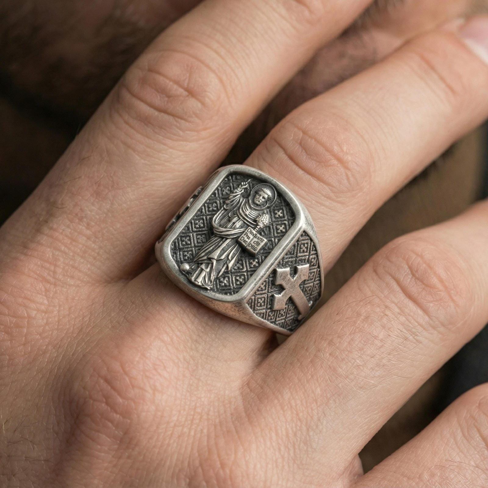 Oxidized 925 sterling silver Saint Dominic signet ring worn on finger, preacher saint relief and cross shoulder