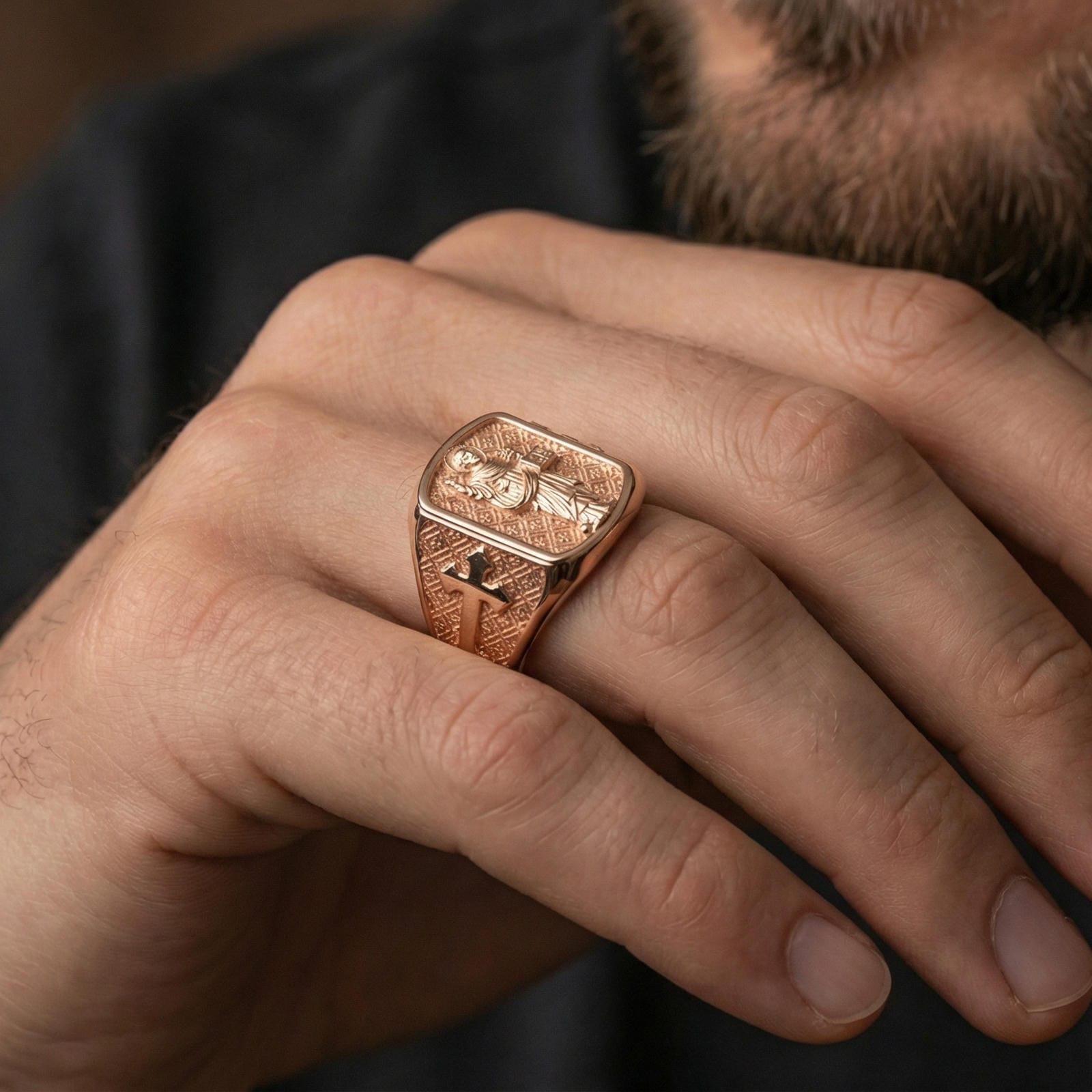 Rose gold plated Saint Dominic ring worn on finger, religious saint portrait signet with cross motif shoulder
