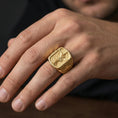 Load image into Gallery viewer, Gold plated Saint Michael ring worn on finger, archangel Michael slaying dragon design with cross band
