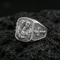 Load image into Gallery viewer, Polished silver Holy Family signet ring on porous volcanic stone, family portrait engraving and cross side panel
