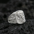 Load image into Gallery viewer, Polished silver Jesus of Nazareth signet ring on porous volcanic stone, detailed Christ portrait and cross band
