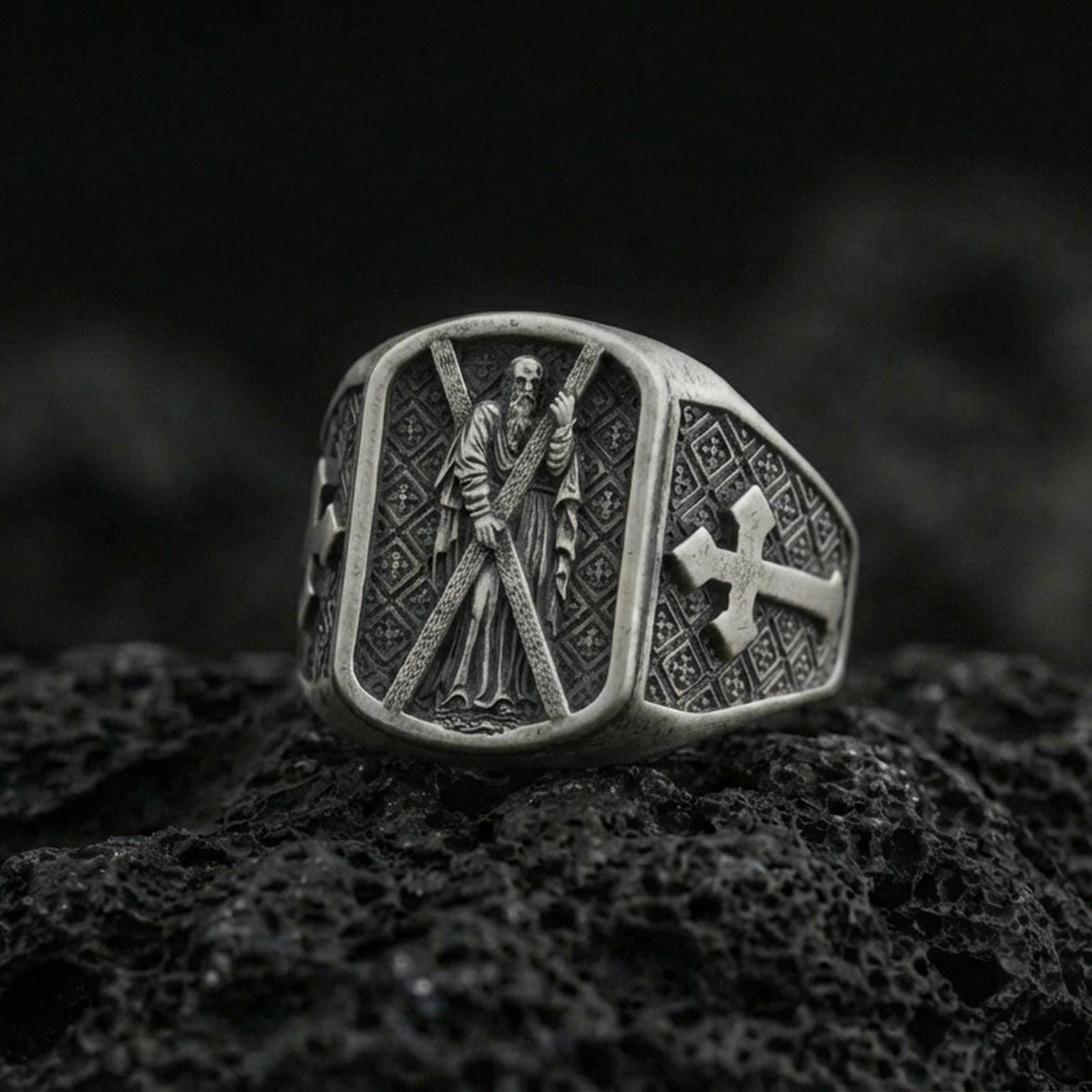 Oxidized 925 sterling silver Saint Andrew ring on volcanic rock, apostle holding cross with cross motif side panel