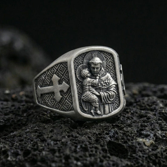 Oxidized 925 sterling silver Saint Anthony ring on volcanic rock, saint holding Child Jesus relief with cross side panel