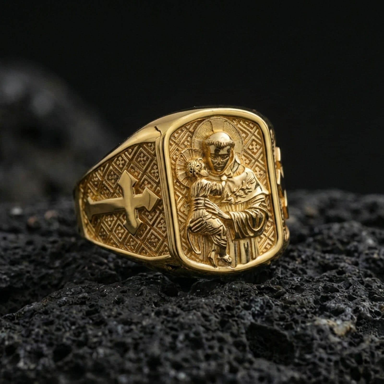 Gold plated Saint Anthony sterling silver ring on volcanic rock, saint holding Child Jesus relief with cross band side detail