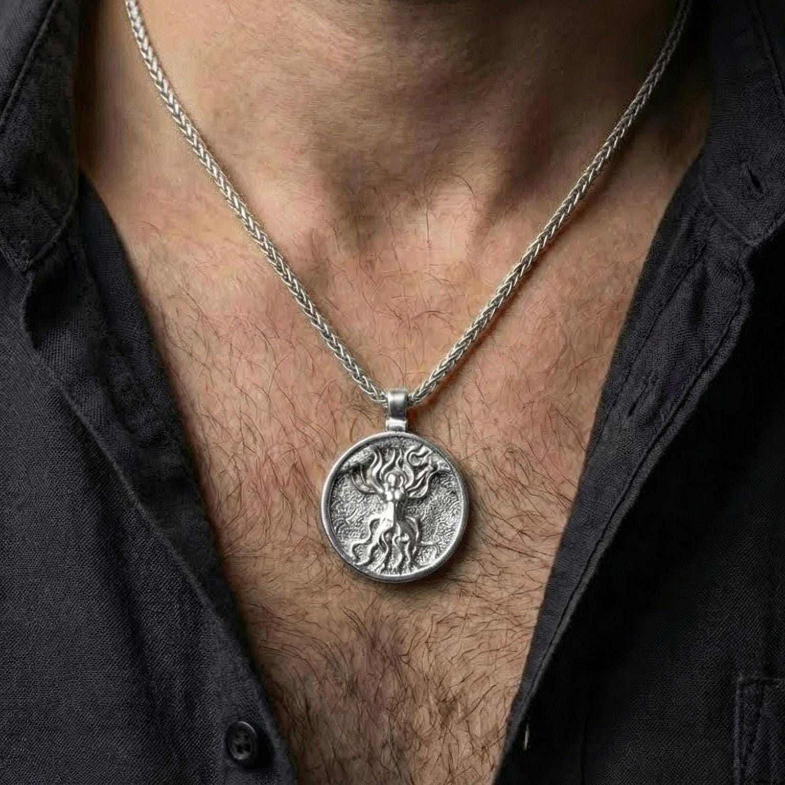 Polished silver sacred tree goddess necklace worn on chest highlighting earth mother symbolism