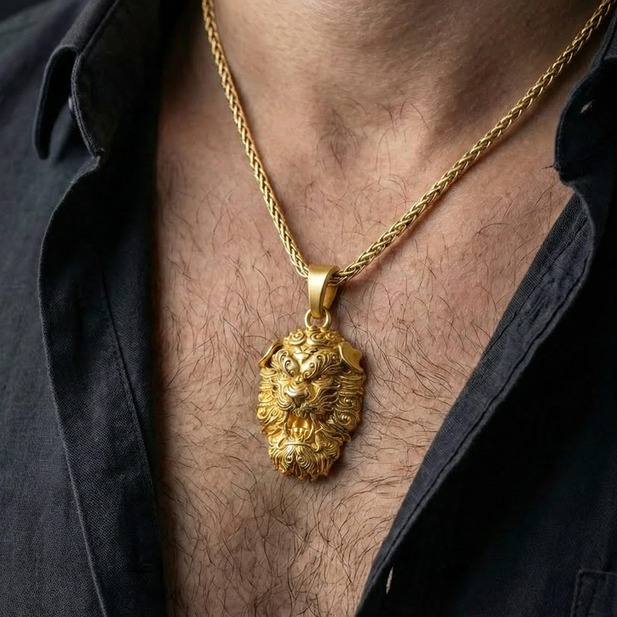 Gold plated Fu Dog pendant necklace worn by man as bold spiritual protection statement jewelry