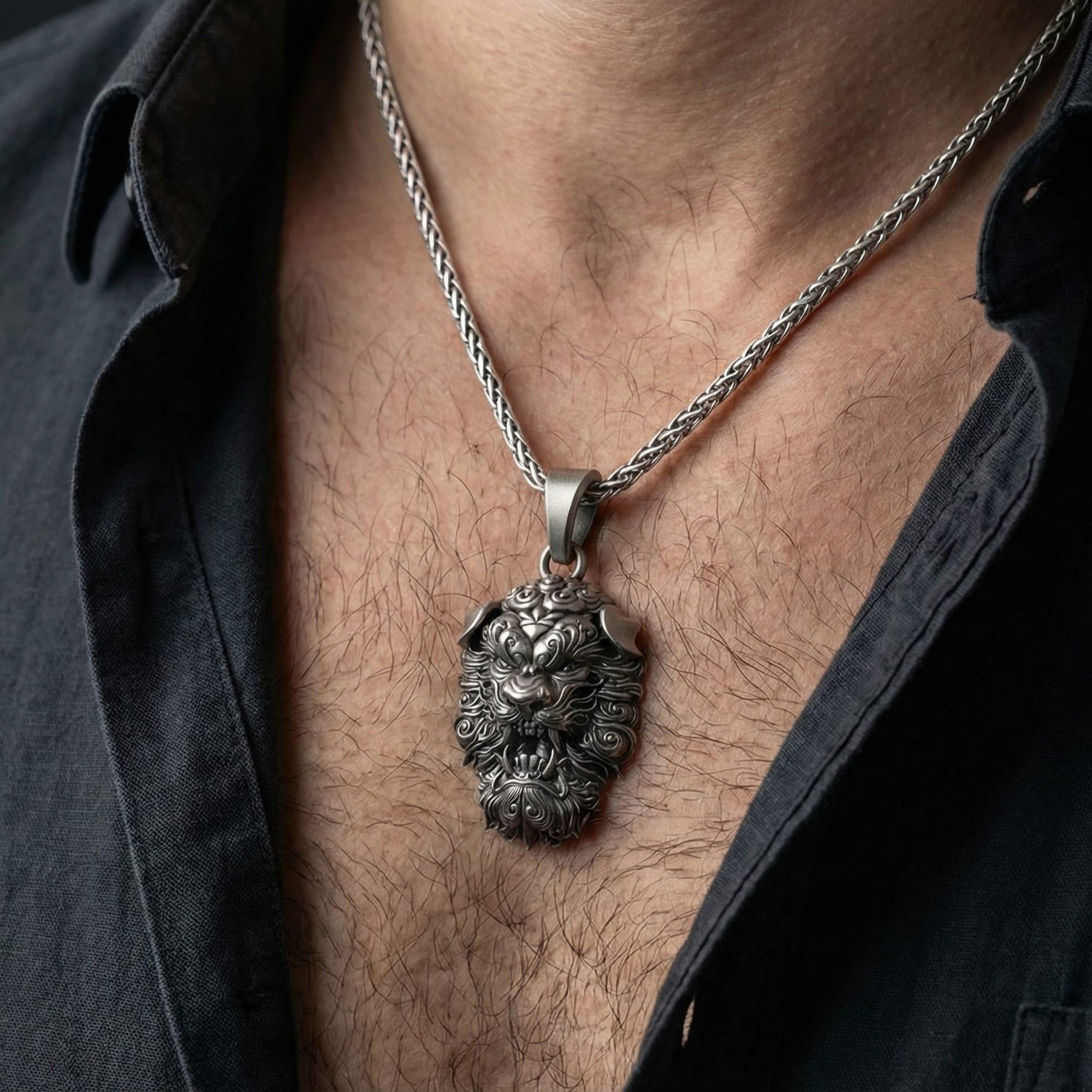 Oxidized Fu Dog pendant necklace worn on male model as a protective guardian lion talisman