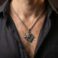 Load image into Gallery viewer, Oxidized Fenrir wolf pendant necklace worn on male model as a Norse guardian talisman
