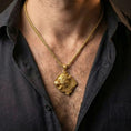 Load image into Gallery viewer, Gold plated Fenrir wolf pendant necklace worn by man as bold Viking statement jewelry
