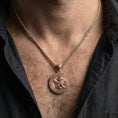 Load image into Gallery viewer, Rose gold plated winged lion amulet necklace worn on model with masculine classical warrior style
