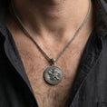 Load image into Gallery viewer, Oxidized winged lion pendant necklace worn on male model as a guardian amulet talisman
