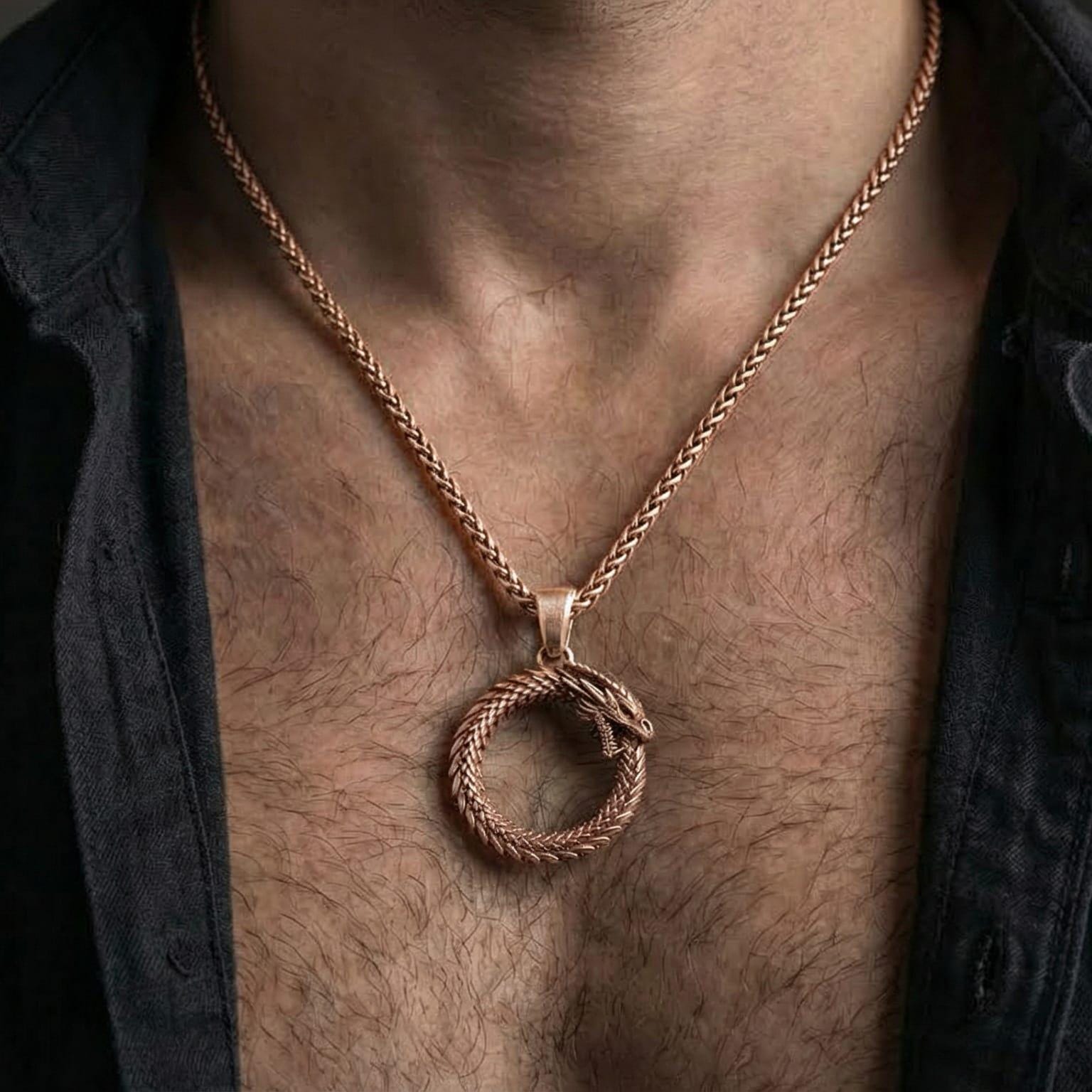 Rose gold plated ouroboros necklace worn on model with timeless mythic and philosophical style