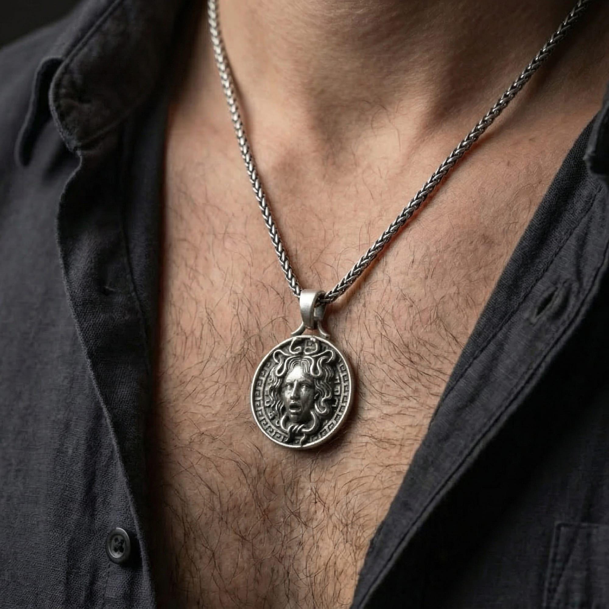 Oxidized Medusa pendant necklace worn on male model as a protective Greek myth talisman
