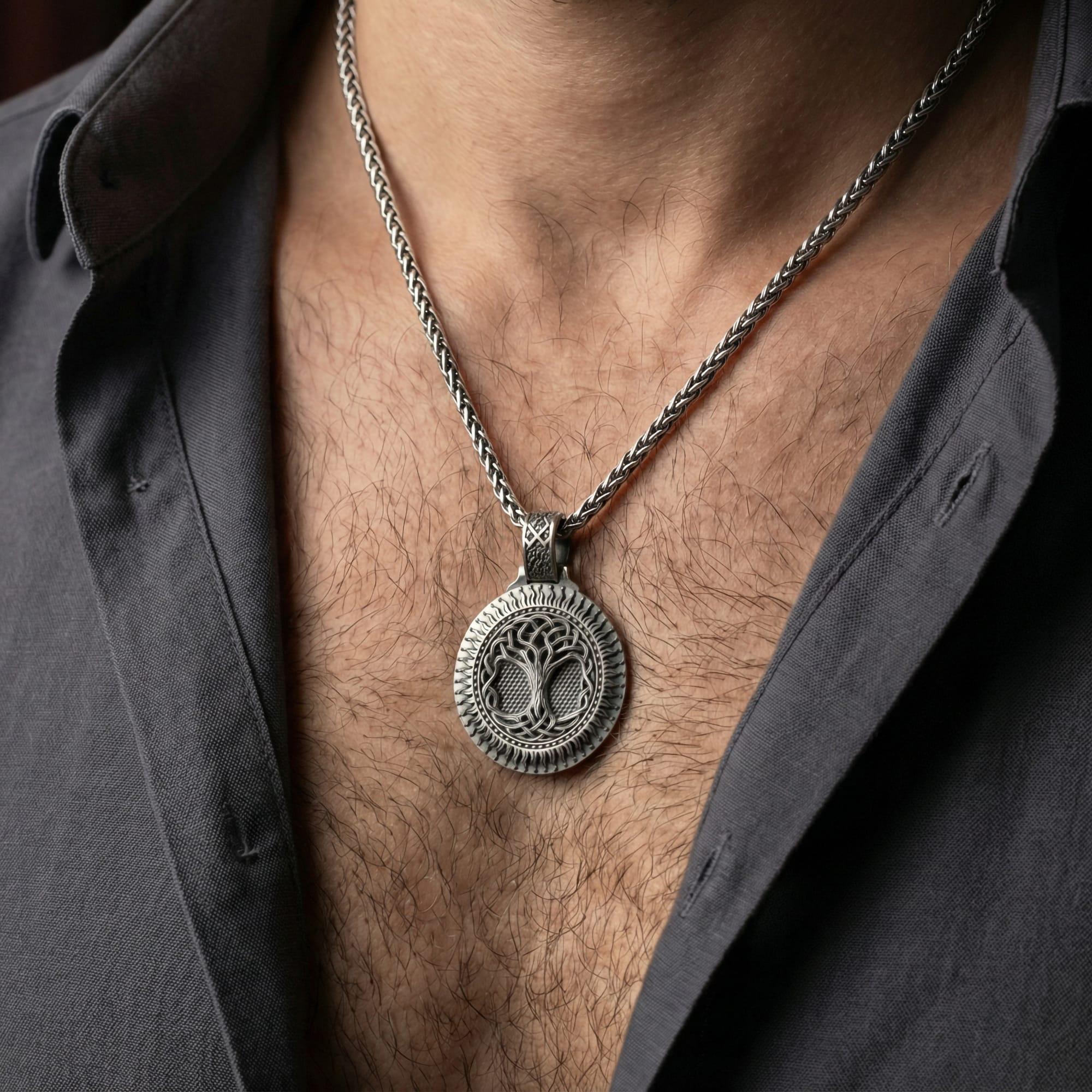 Oxidized Yggdrasil tree of life pendant necklace worn on male model as a Norse spiritual talisman
