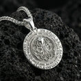 Load image into Gallery viewer, Polished silver Cthulhu sigil pendant displayed on volcanic stone background with intricate circular relief and arcane text
