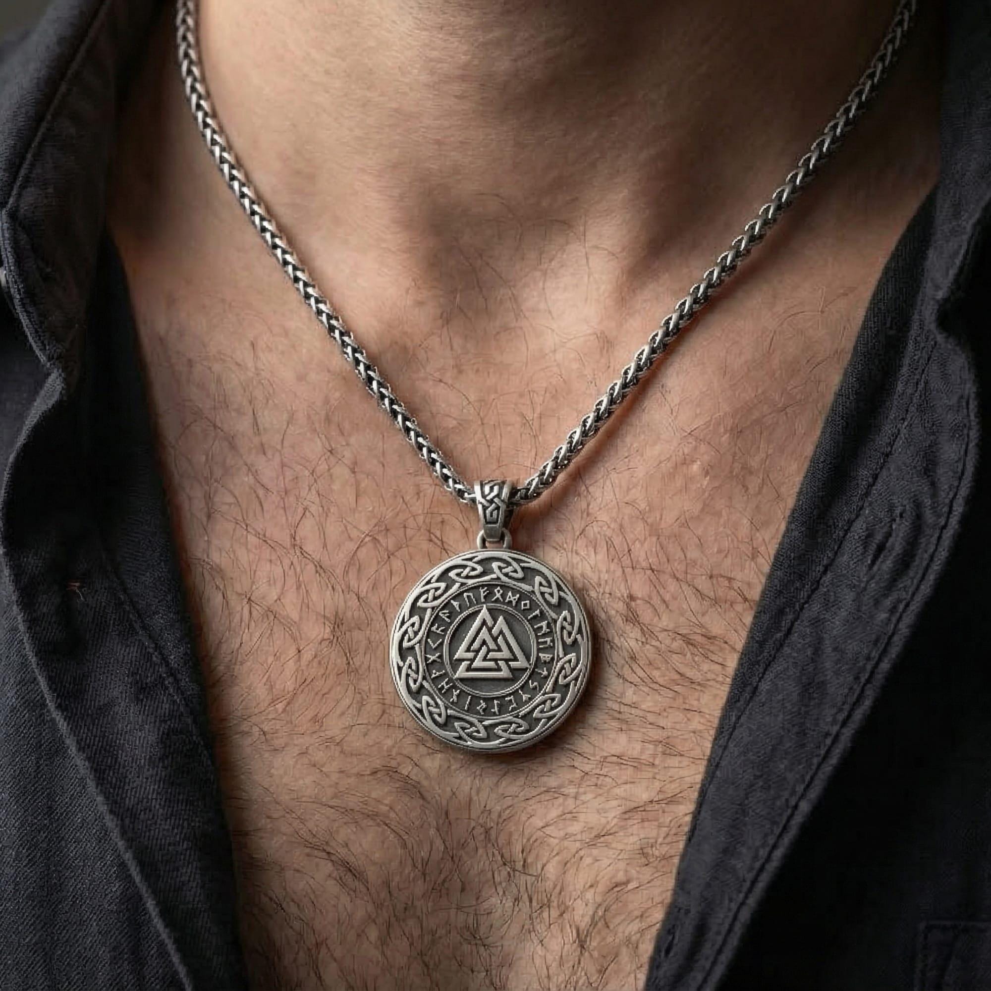Oxidized Valknut rune pendant necklace worn on male model as a Norse warrior talisman