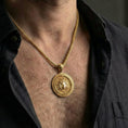 Load image into Gallery viewer, Gold plated Medusa mythology pendant worn by man as bold statement jewelry inspired by ancient Greece
