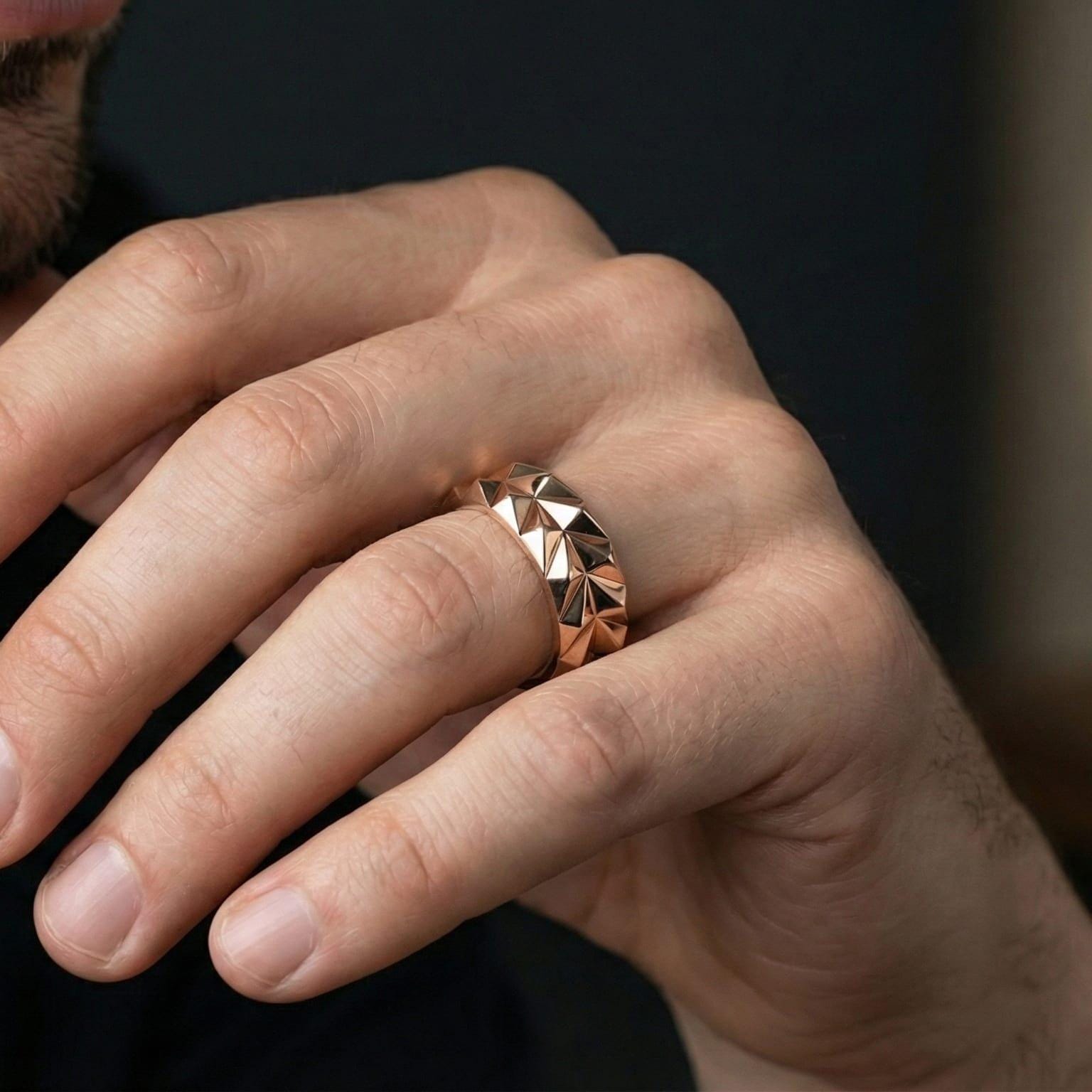 Rose gold plated geometric silver band ring worn on model with refined contemporary style and sculptural elegance