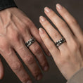 Load image into Gallery viewer, Oxidized geometric faceted band ring worn on finger as a bold industrial statement with modern masculine edge
