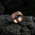Load image into Gallery viewer, Rose gold plated faceted texture ring presented on volcanic rock surface with premium sculpted prism detailing and sleek minimalist style
