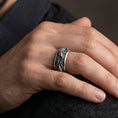 Load image into Gallery viewer, Oxidized dragon carp spinner ring worn on finger as a power and prosperity talisman with rotating fidget band
