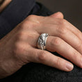 Load image into Gallery viewer, Polished silver dragon and carp fish ring worn on hand emphasizing sculpted relief detail and smooth spinner function
