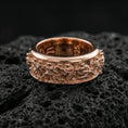 Load image into Gallery viewer, Rose gold plated classical Greek crowd relief band ring showcased on volcanic rock emphasizing ornate engraving and heritage style
