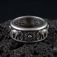 Load image into Gallery viewer, Oxidized spinner fidget elephant ring photographed on volcanic rock, 925 sterling silver band with raised elephant and sun motif, engravable inside
